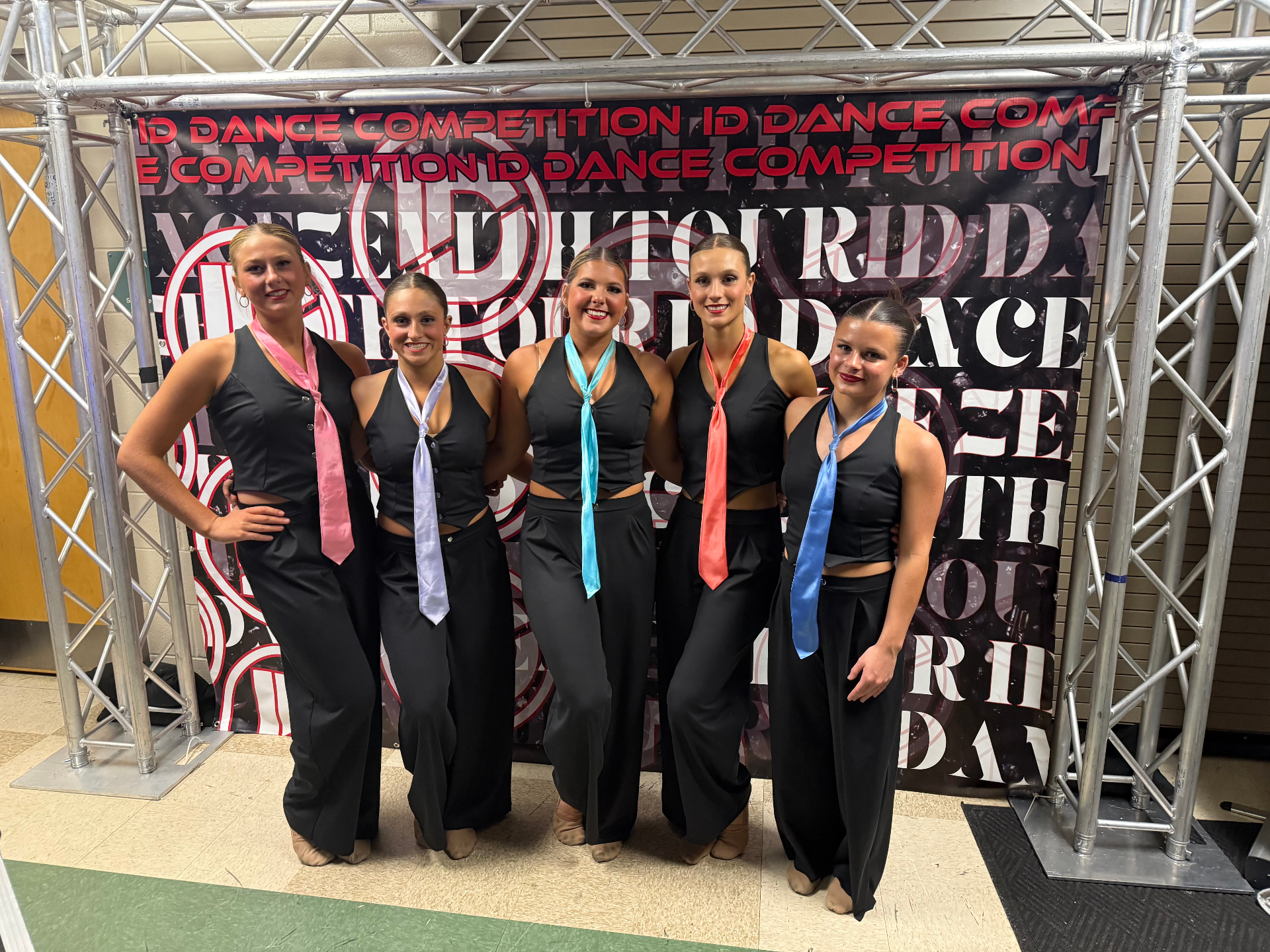 Team backstage in black with satin ties