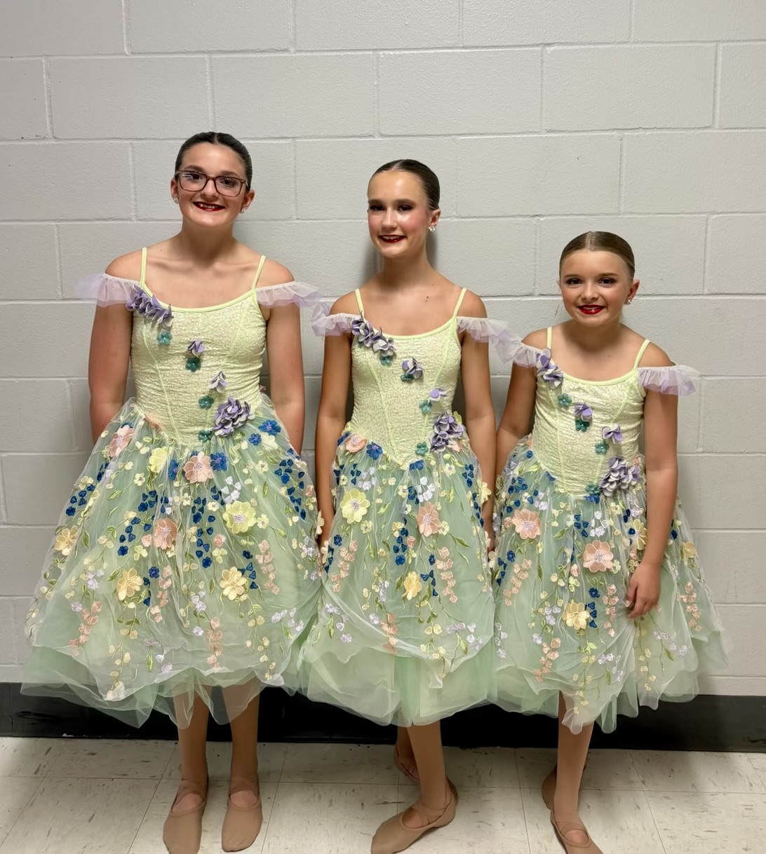 Trio in floral ballet costumes